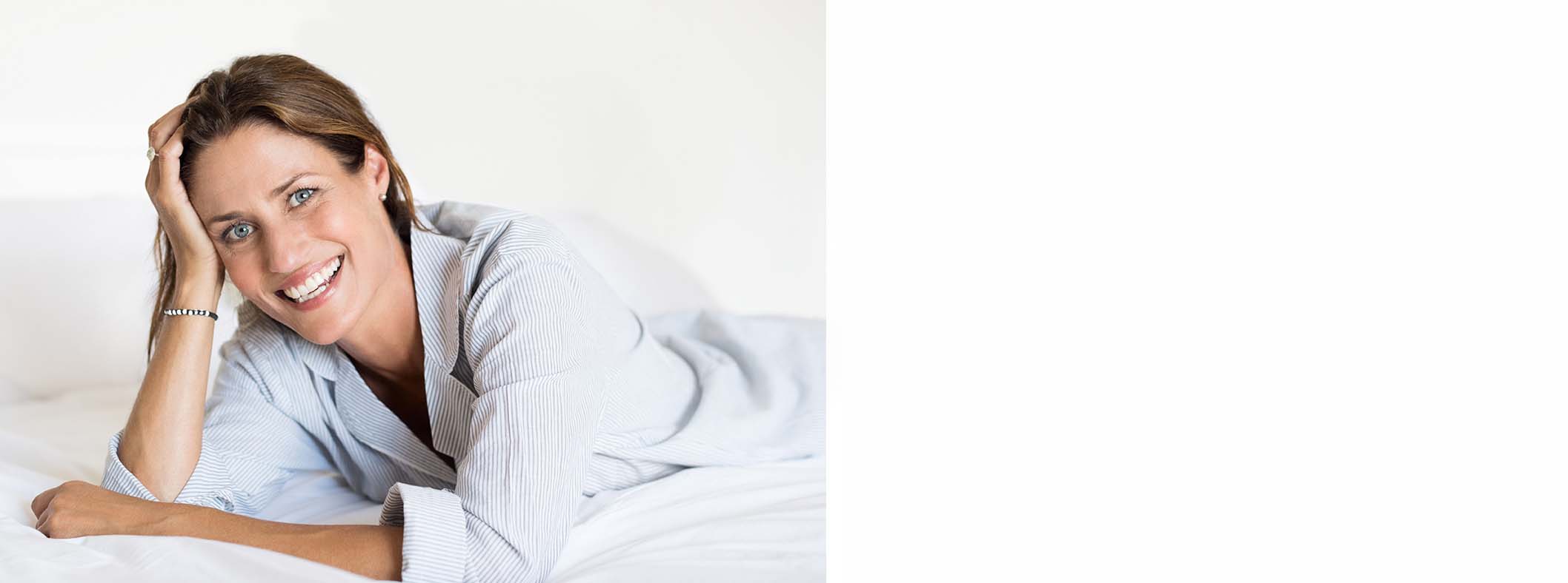 Brunette woman wearing a white sweater