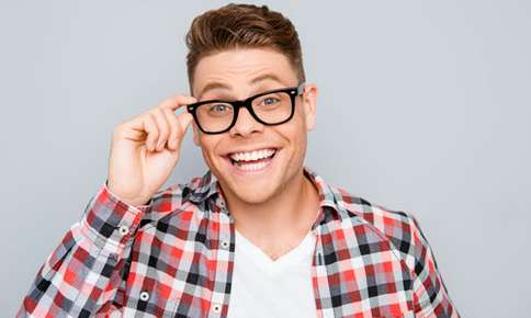 Man with thick black glasses frames