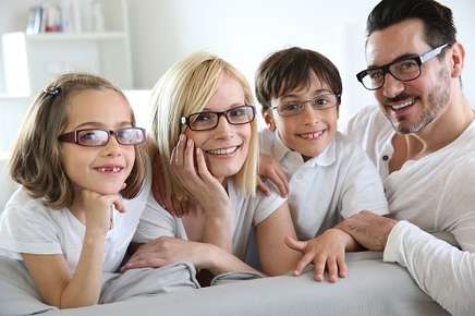Happy family members all wearing glasses