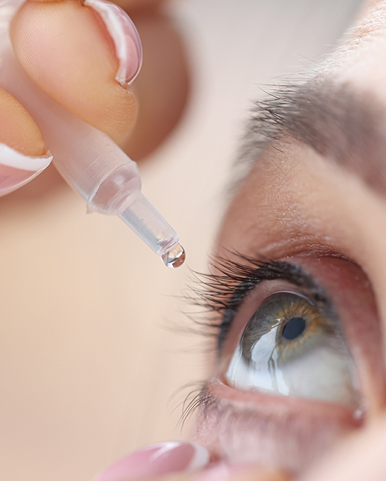 Eye drops being applied to eye