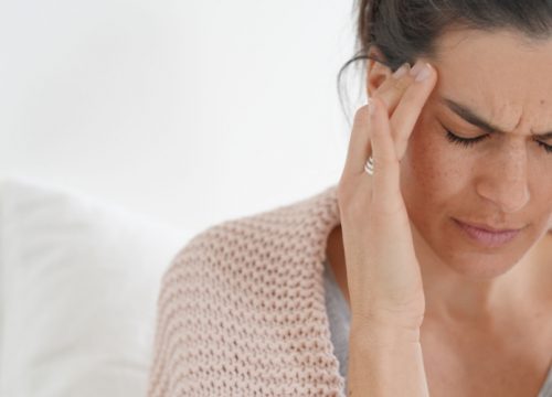 Woman who experiences chronic headaches