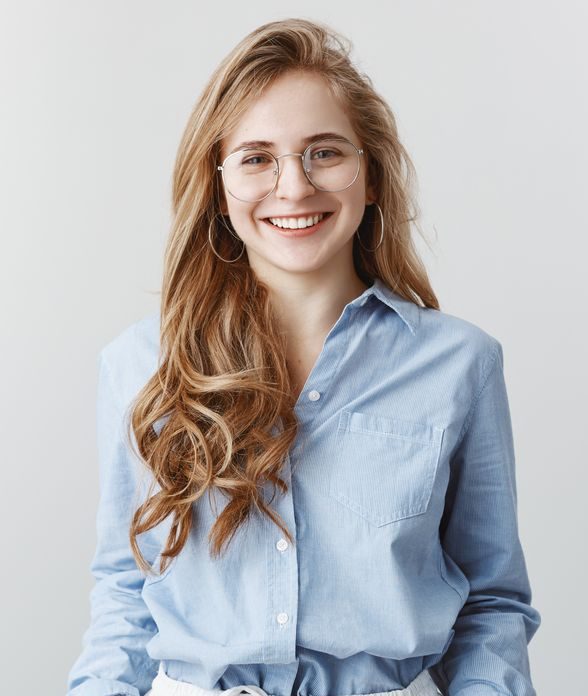 Smiling young woman wearing glasses and a blue shirt